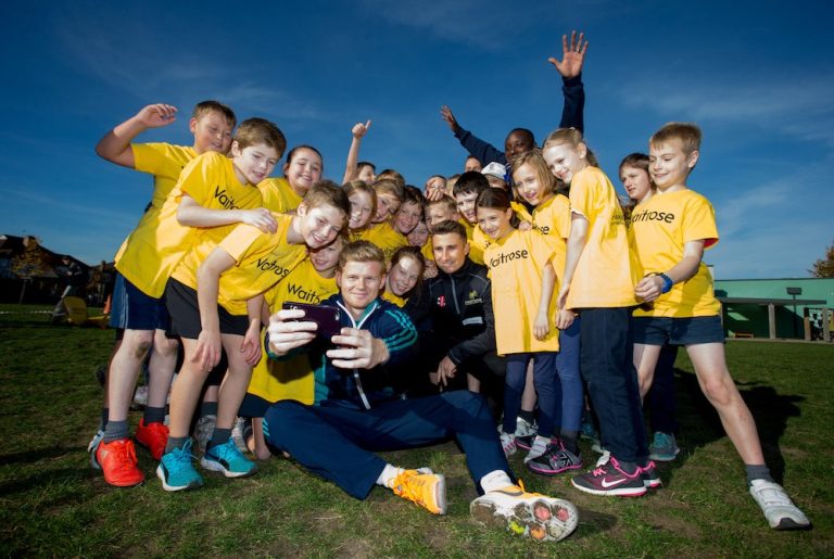Sam Billings and James Taylor pose for a selfie with children from Peter's Primary School during ECB Chance to Shine Event copy
